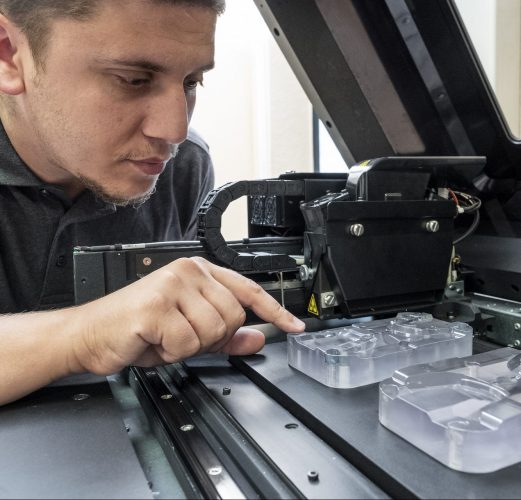 Employee at work with 3D printing and prototyping at De Beer Group